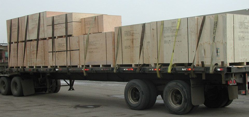 flatbed loaded with crates for shipping